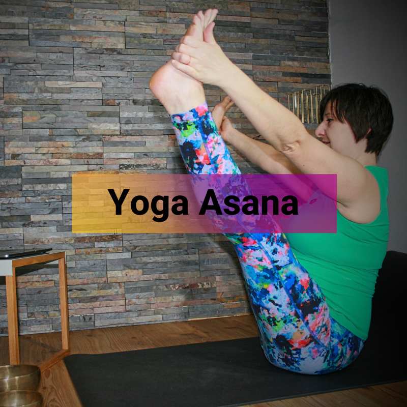 Liz is side-on to the camera, in Navasana - Boat Pose - teaching a class via Zoom. The page title 'Yoga Asana' is overlayed across the centre of the image