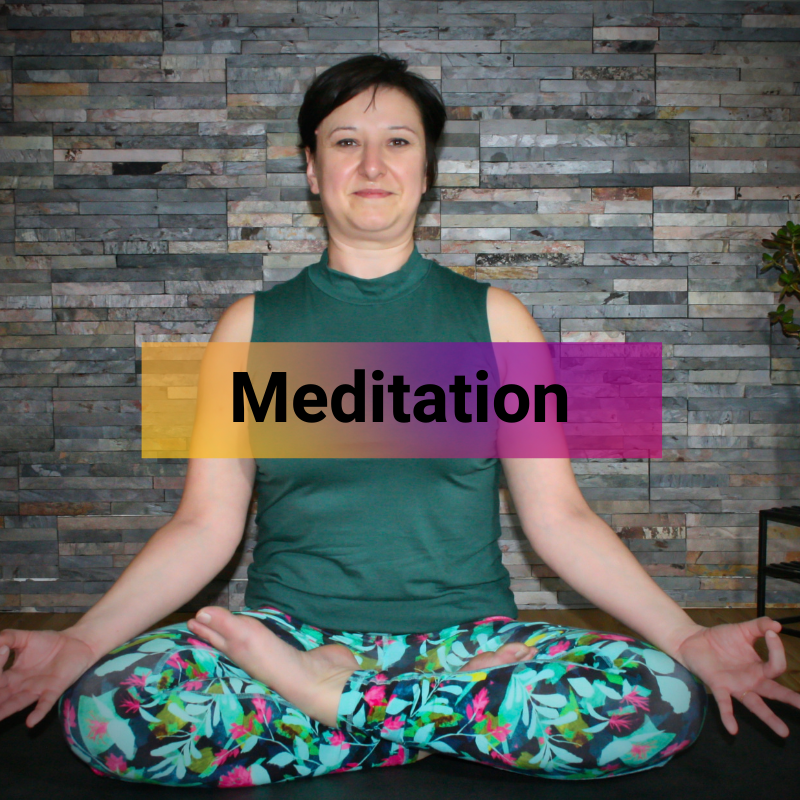 Liz is facing the camera, positioned in half lotus pose. The word 'Meditation' is overlayed across the centre of the image
