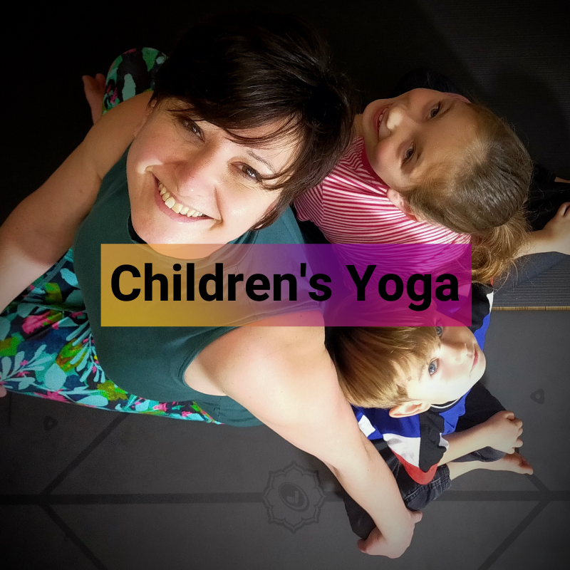 Rounded image of a children's yoga class, linking to Children's Yoga sessions from reaLIZe yoga in Grantham