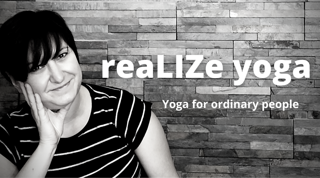 Black and white image of Liz facing the camera smiling, against a wall. The title and tag line 'reaLIZe yoga. Yoga for ordinary people' is in white across the centre of the image
